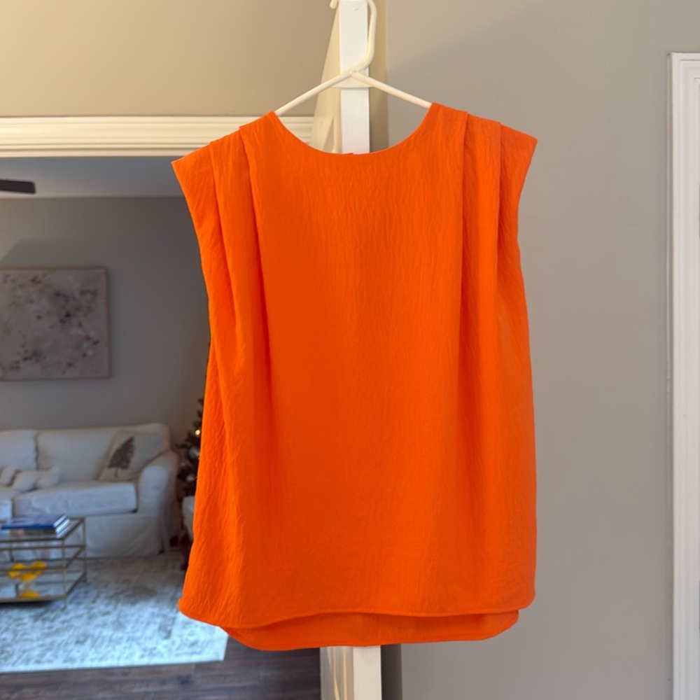 Kittenish orange sleeveless blouse medium